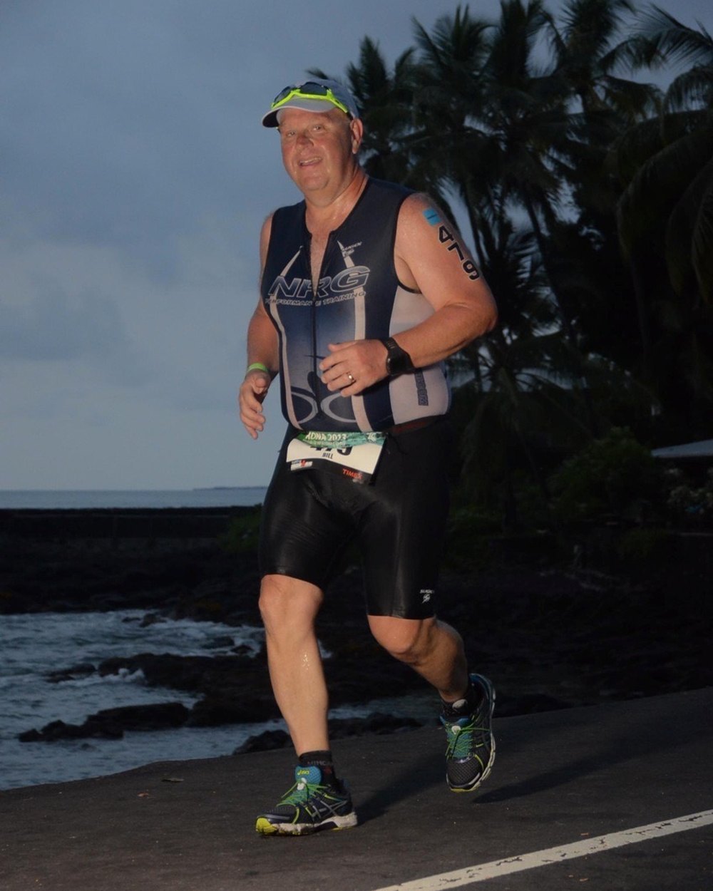 Bill Best running the marathon leg of the Ironman World Championship on the coast road at Kailua-Kona, October 2013